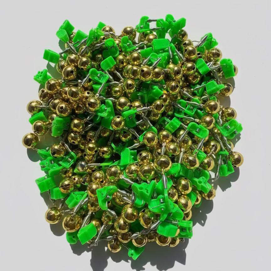 Close-up of green and gold metal components