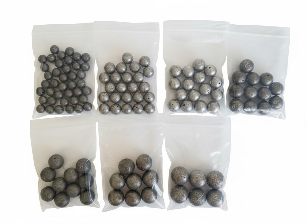Multiple bags of small round objects with labels on a textured surface